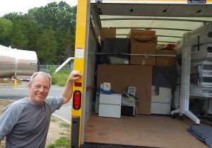 John Kaiser with van loaded with donated equipment