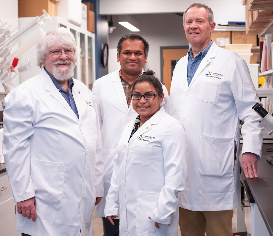 Nanovaccine researchers stand in a lab