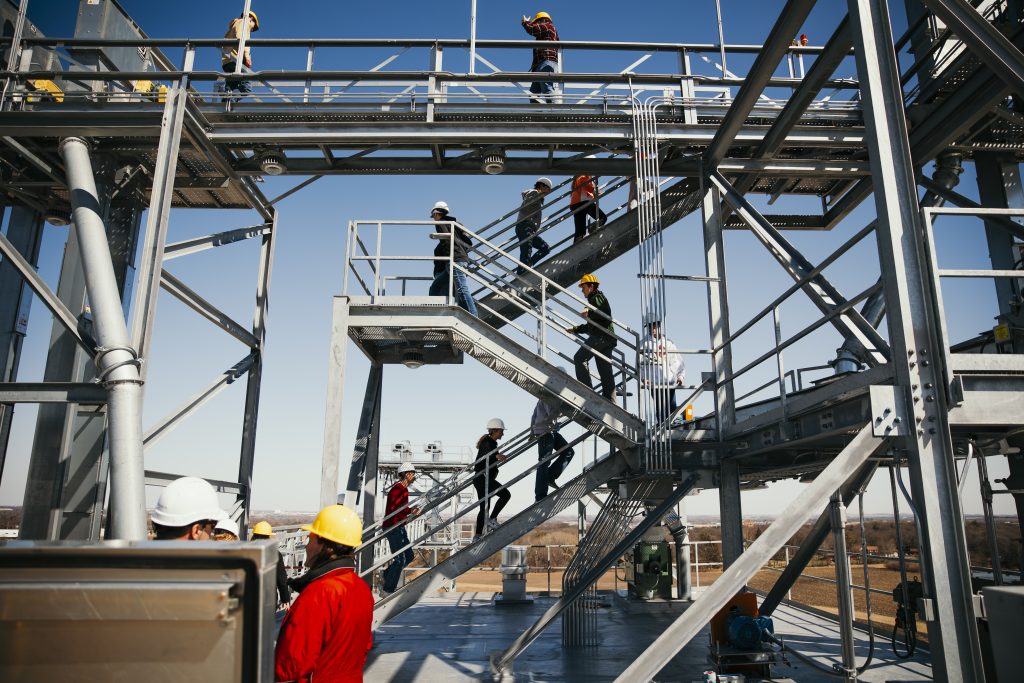 Students climbing the feed mill tower