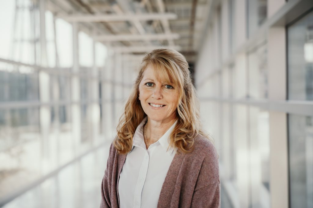 Joanne Kuntz standing inside the skywalk on Iowa State University 