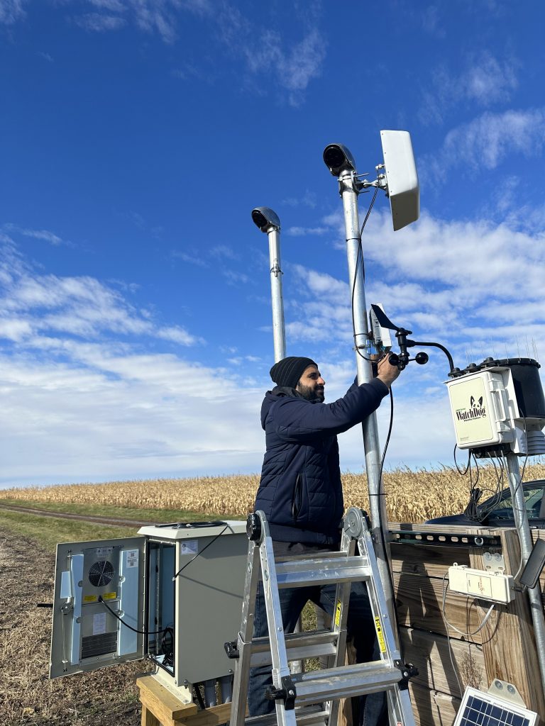 Taimoor UI Islam, outside, deploying ARA radios in the field.