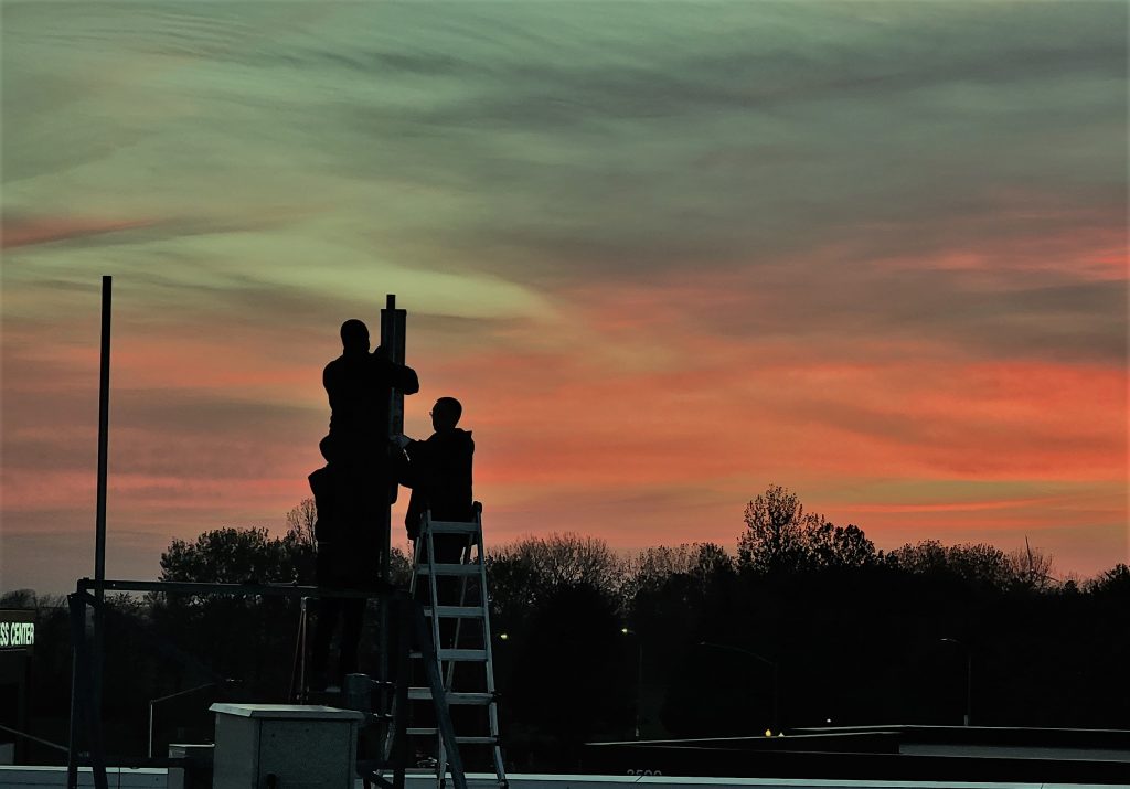 ARA team members deploying radios on the rooftop of Research Park. 