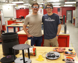 HABET team members Andrew Krall (left) left and Mason Henry in M:2:I lab wearing protective eclipse sunglasses