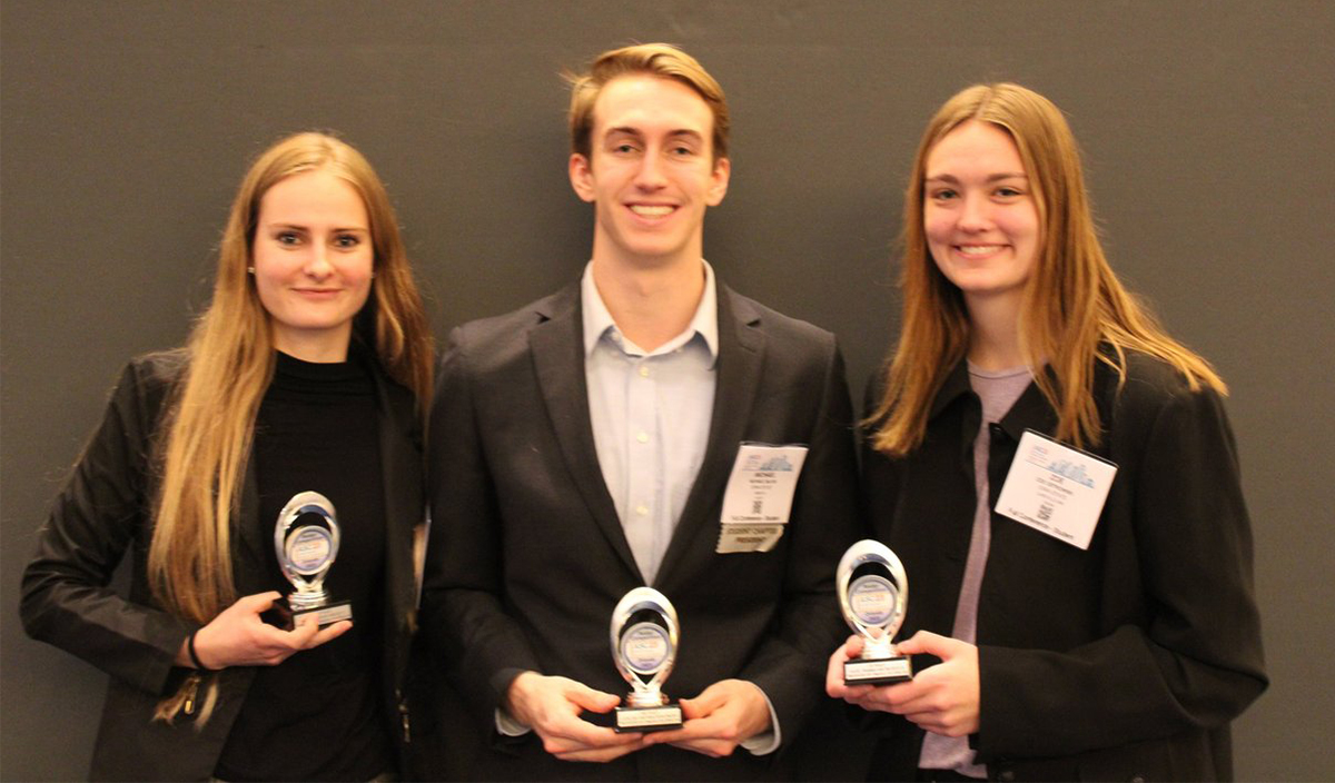 Victoria Kyveryga, Michael Galvin and Zoe Ostrowski pictured with trophies after strong finishes in their respective poster competitions