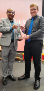 Andrew Barloon with award and Partha Sarkar
