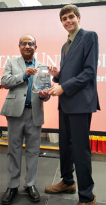 Cooper Lind with award and Partha Sarkar