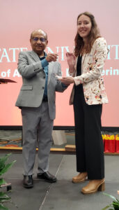 Evelyn Moyer with award and Partha Sarkar
