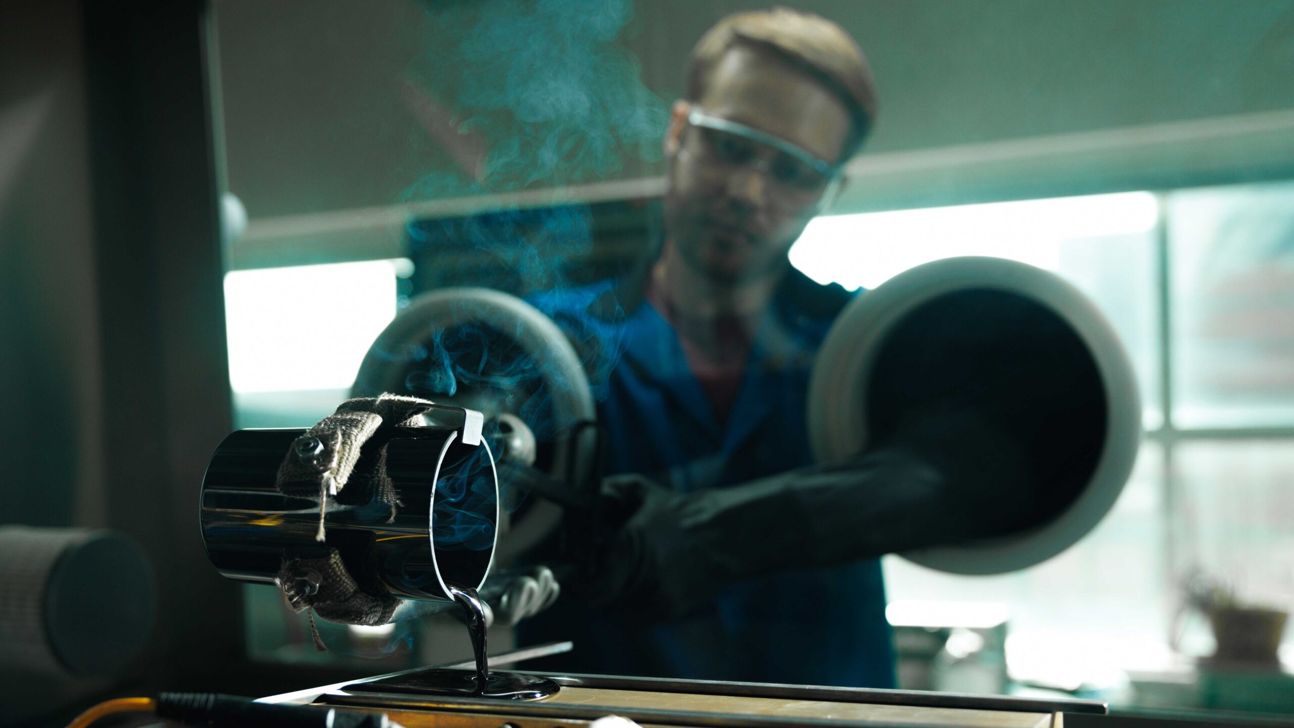 MSE graduate student Jacob Wheaton pouring glass