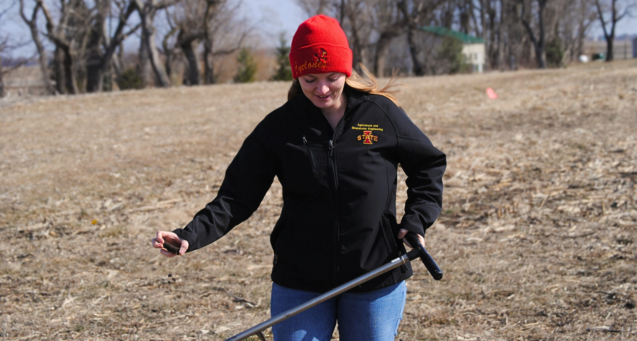 ABE grad student taking soil sample