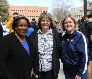 Carmen Fuchs (center) with others on campus during the April 8 eclipse
