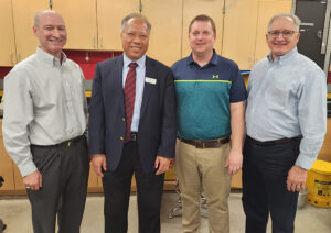 Wayne Chen in department lab with Industrial Advisory Council members and faculty member Travis Grager