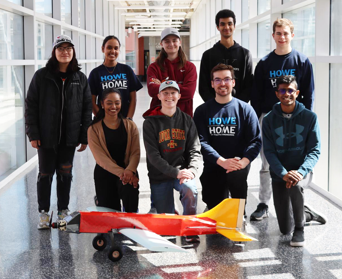 Design Build Fly team members with plane