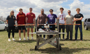 Team with their craft at the flight test field