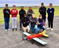 Members of the DBF team with their aircraft