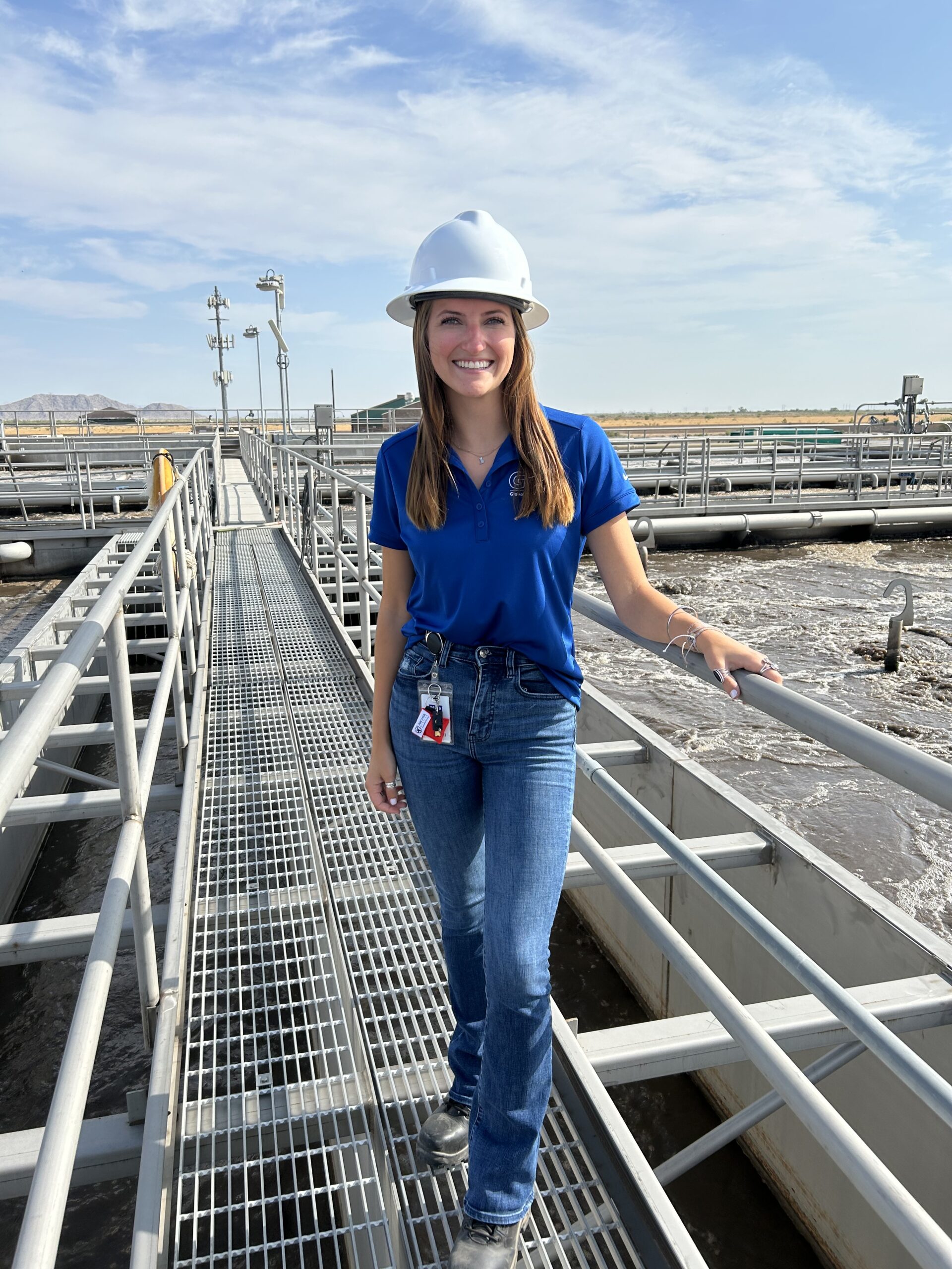 Emily DeJesu standing with hard hat on. 