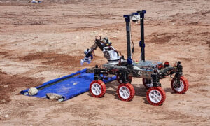 Close-up photo of MAVRIC rover performing a test in the desert at the University Rover Challenge in Utah