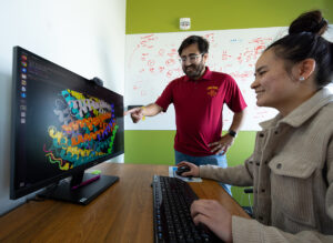 Ratul Chowdhury with student working on computer in lab