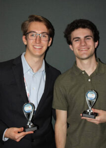 Students Michael Galvin and Aaron Bal are shown holding trophies they received for their first and second place finishes, respectively, in the research poster competitions