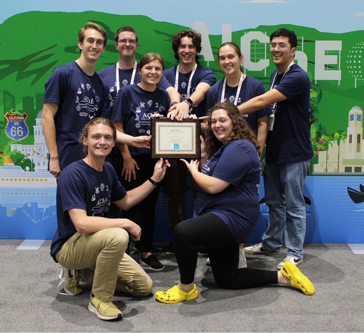 CBE students at AIChE Annual Student Conference shown posing with Student Chapter of the Year Award certificate