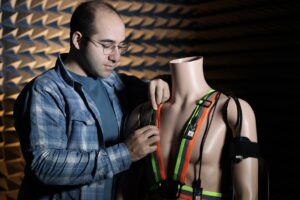 Moh Kashani works on wearable medical devices during testing in the echo chamber.