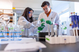 Graduate student Devanshi Mistry and undergraduate student Mac Catanag work in a CBE department lab