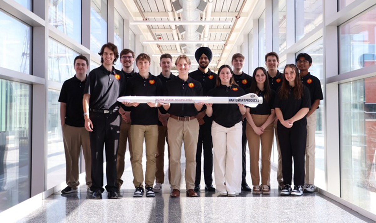 Photo of M:2:I Cy Launch rocketry team holding one of their 3D created rockets.