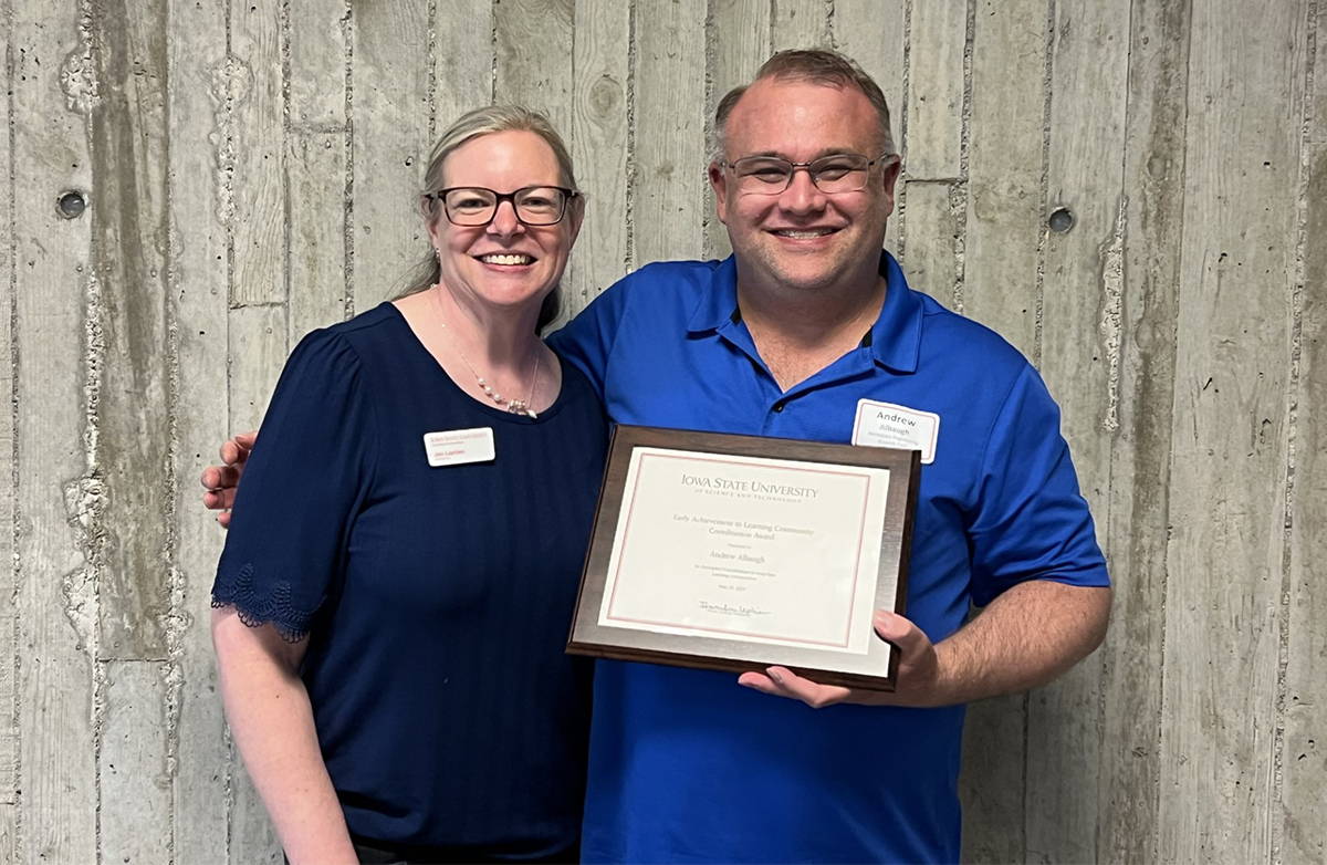 Andrew Albaugh pictured with Iowa State University Learning Communities Director Jennifer Leptien and the award certificate he received.