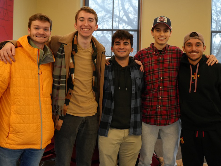 Ernest Mattson and peers smile for a photo.