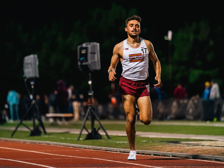 Ernest Mattson runs on a track.
