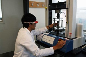 Measuring the strength of an Osteoceramic cement specimen.