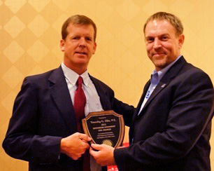 CCEE Associate Professor Tim Ellis (left) receives the 2013 Outstanding Civil Engineer Award from the American Society of Civil Engineers Iowa Section Past President Gary Reed.